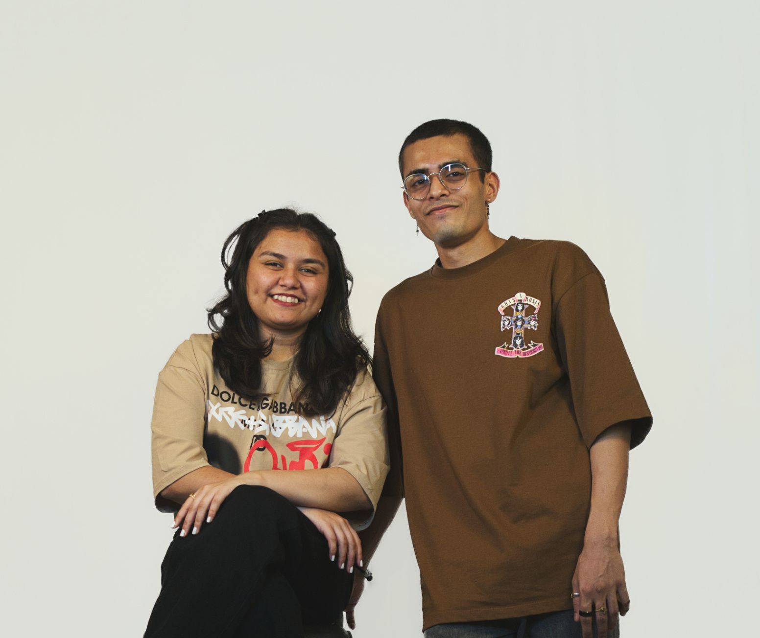 Man and women smiling and looking towards the camera