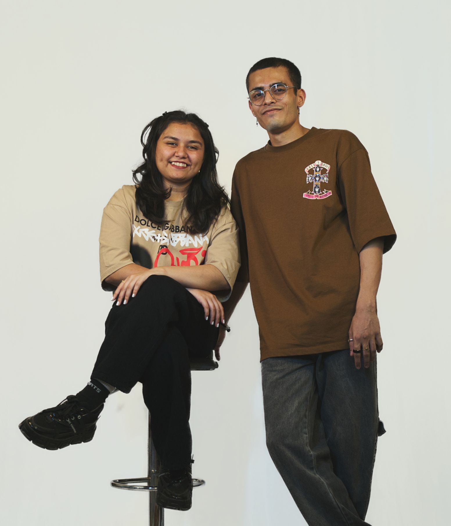Man and women smiling and looking towards the camera
