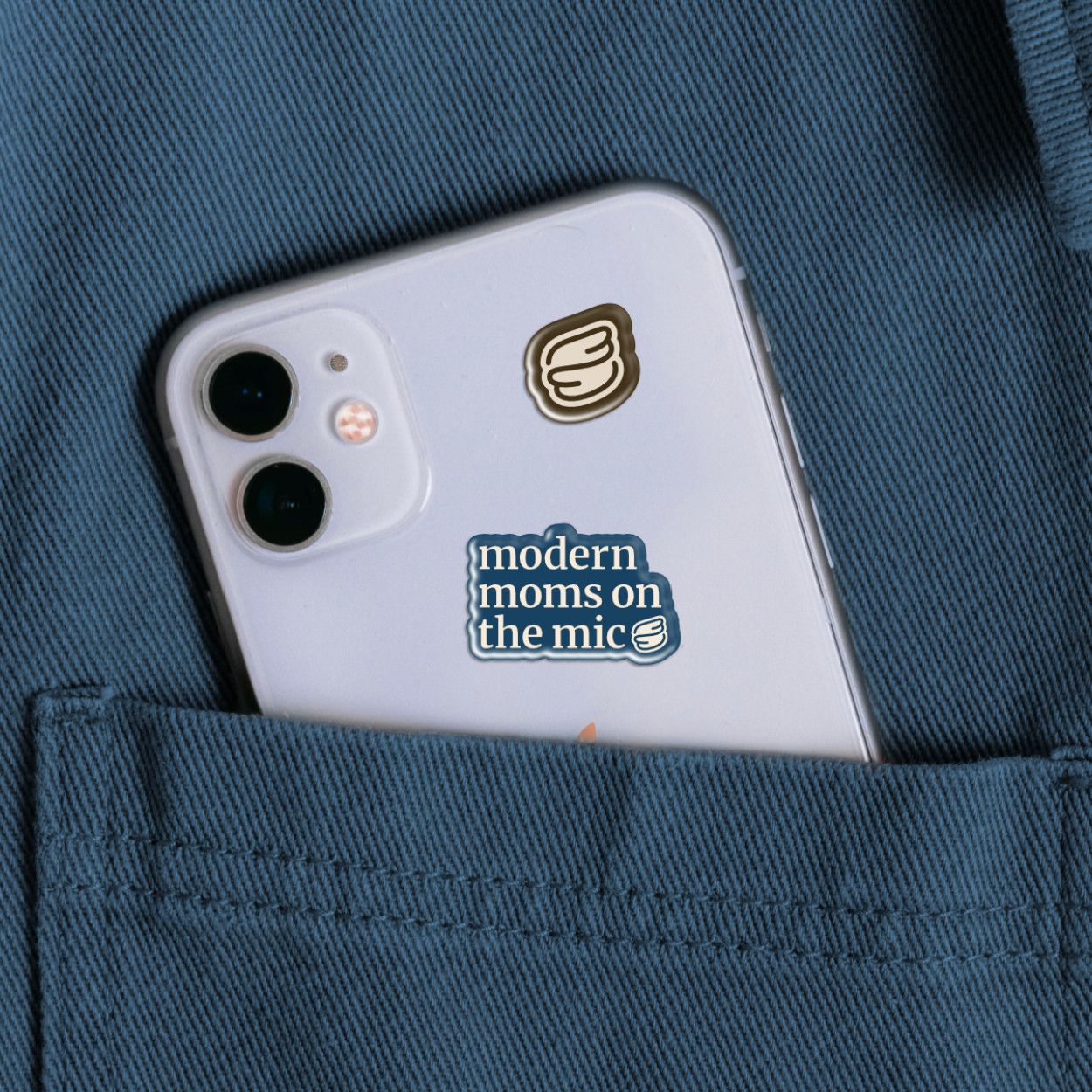 Branded stickers on a back of an iPhone